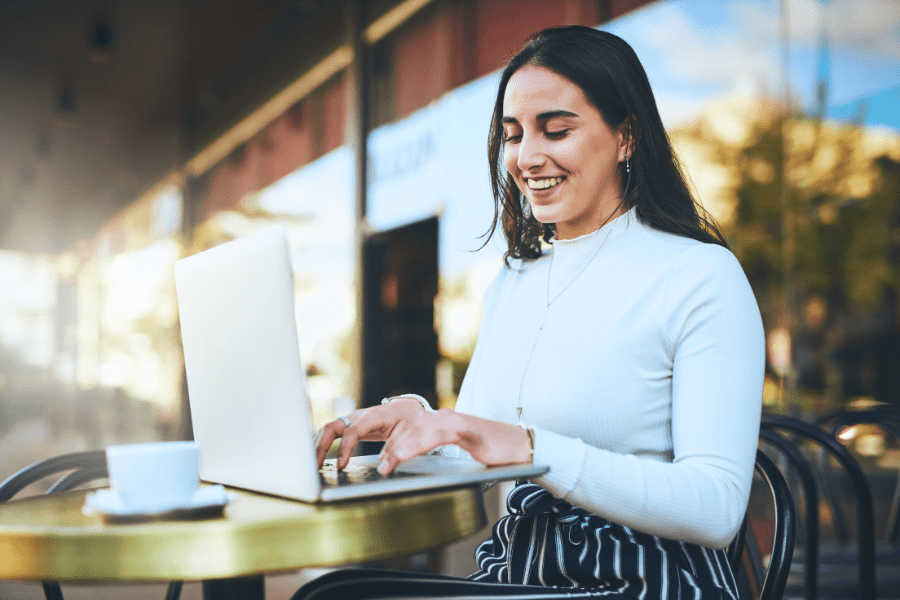 a woman working remotely from a coffee shop