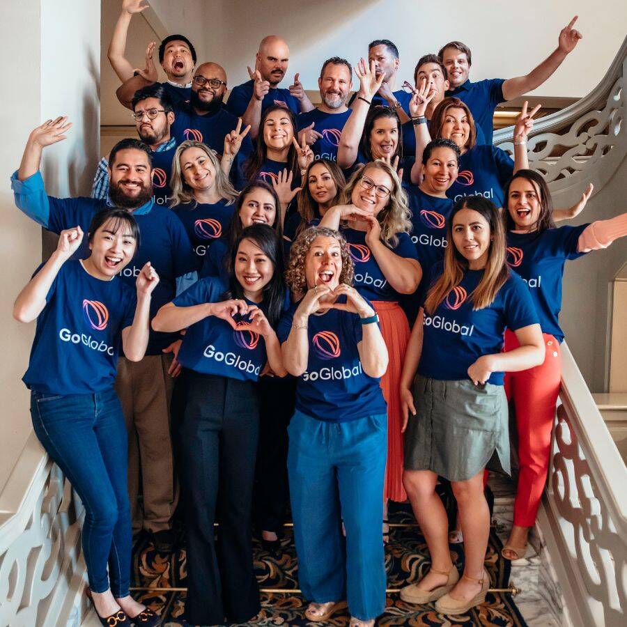 GoGlobal team on stairs having fun