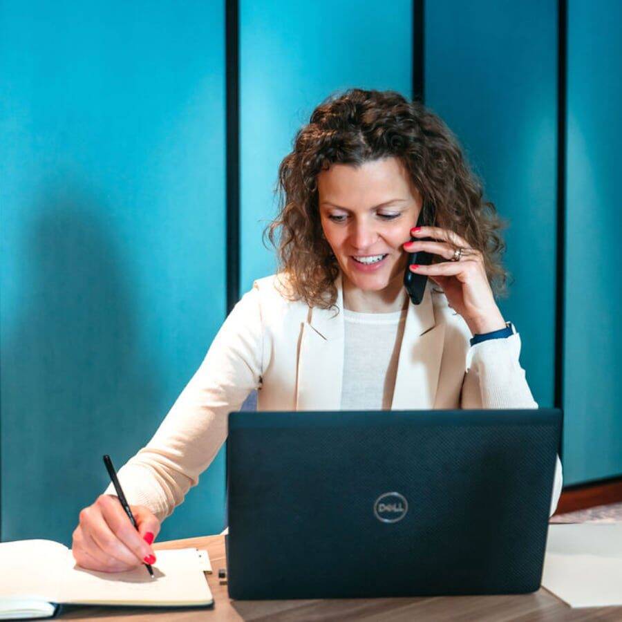 Woman On Phone With Laptop