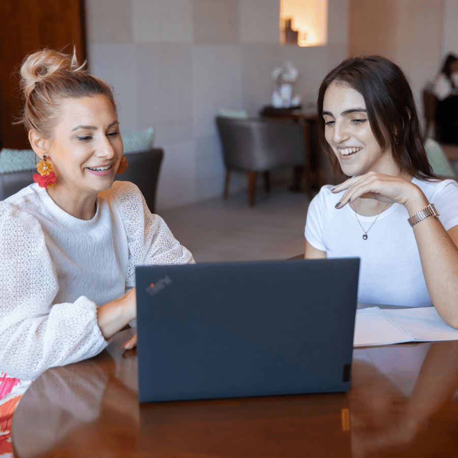 two European colleagues working together on a laptop