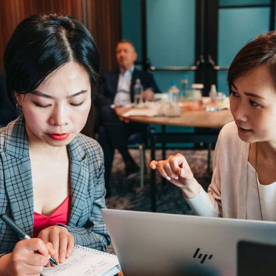 Two Women Working Together With Laptop 900