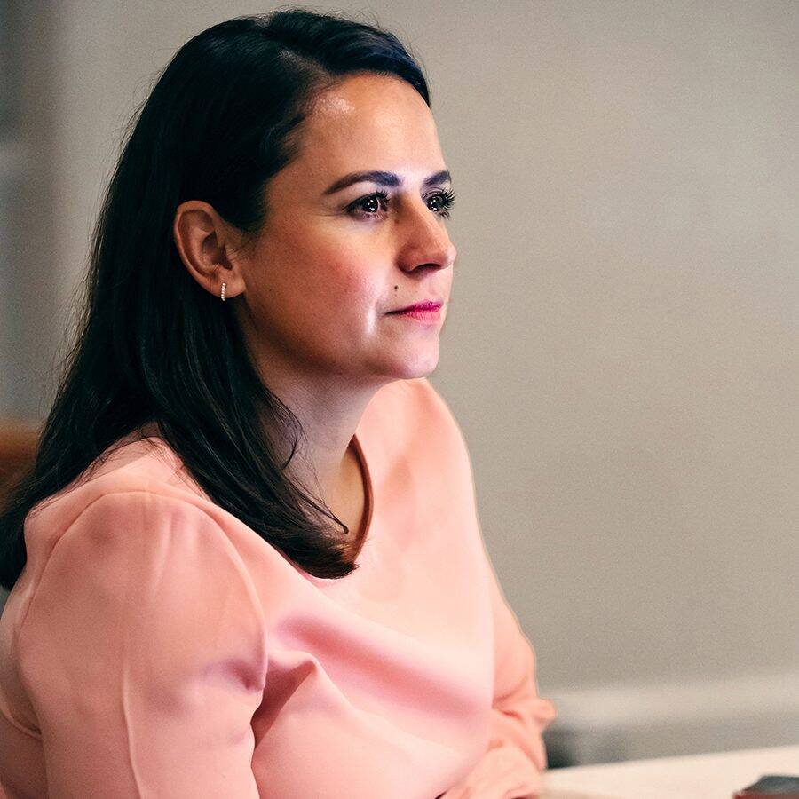 Woman in peach colored shirt